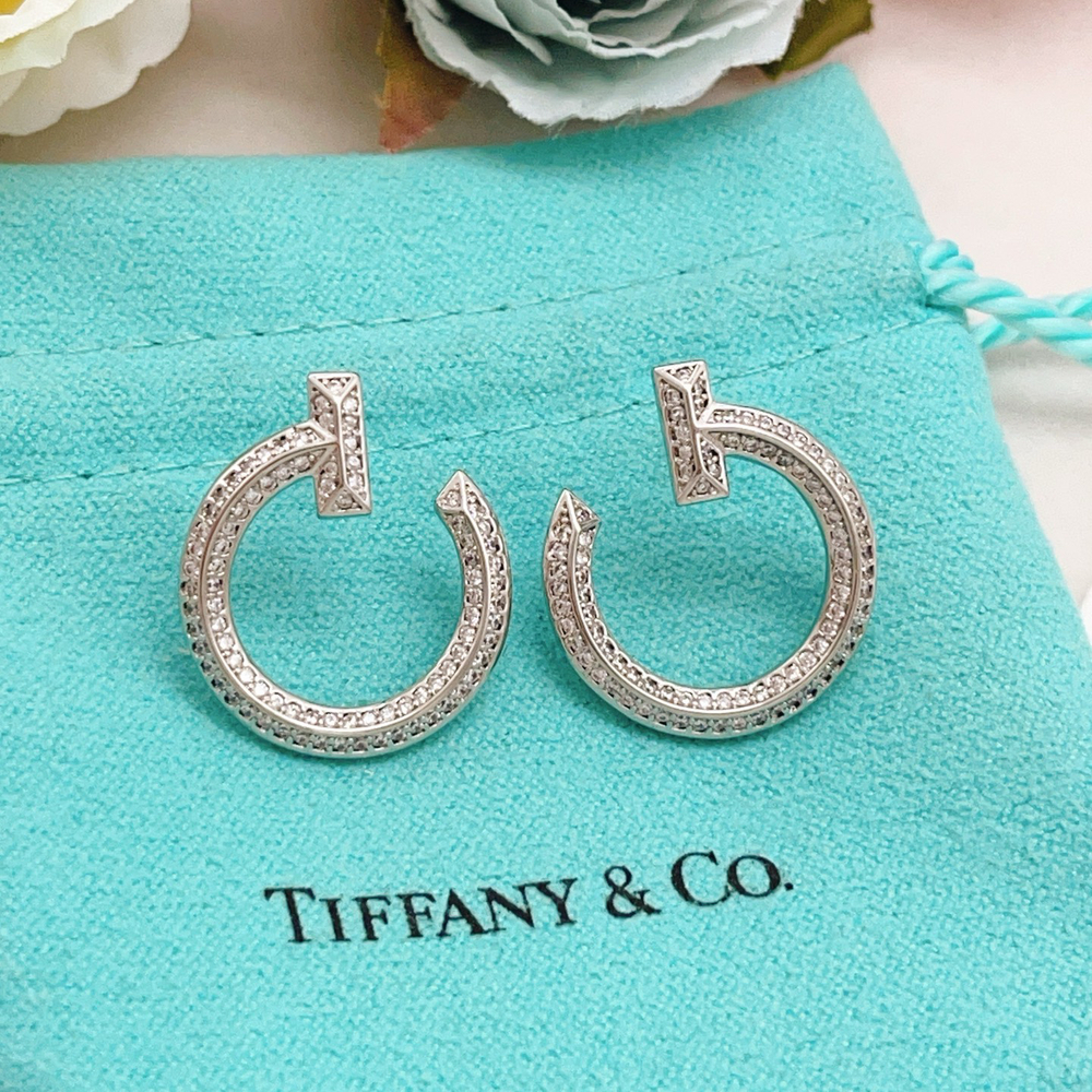 Tiffany & Co. Silver diamond-encrusted smiley face earrings